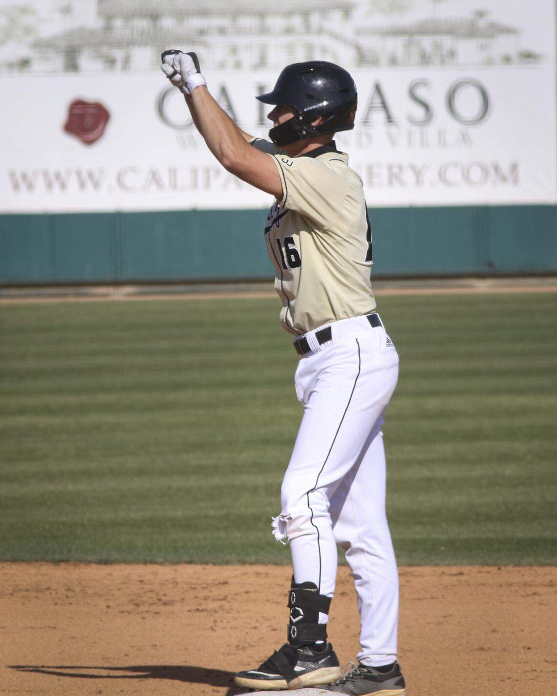 Ryan Tayman signals the dugout after doubling. Cal Poly shut out Santa Clara 7-0 in a baseball game on April 28, 2026.