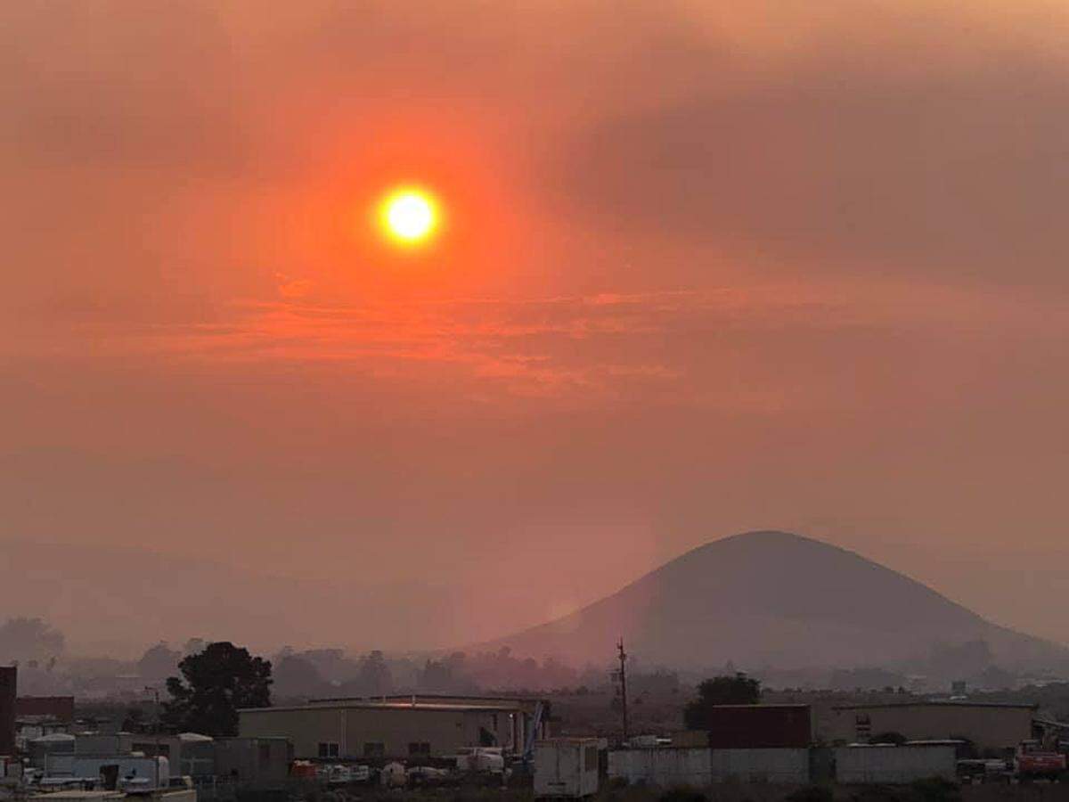 An orange-hued view from Suburban Road looking towards Marigold and Tank Farm Road.