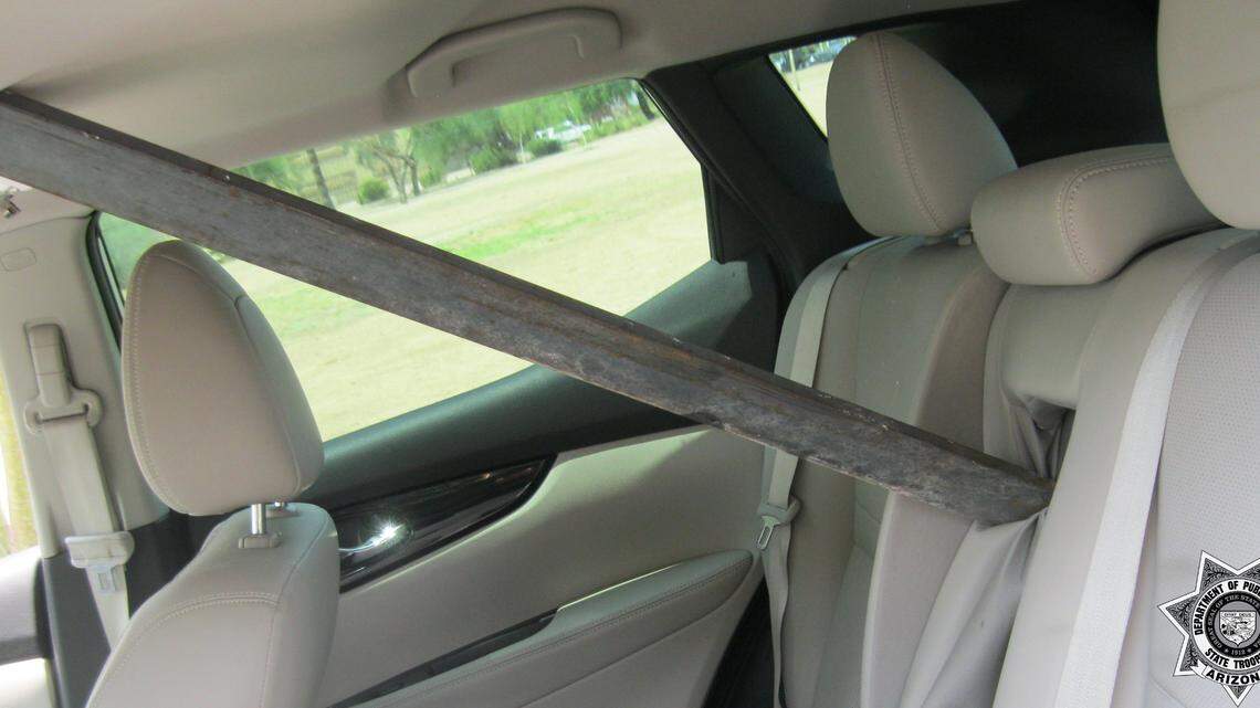 An Arizona driver came within inches of being impaled by a flying metal pole, after it bounced off the back of a nearby pickup truck and sailed through her windshield.