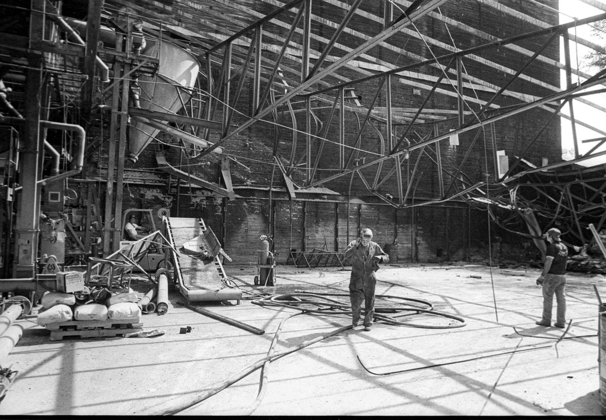 Work begins to restore the fire-damaged landmark Templeton Feed & Grain on Oct 4, 1979, following a fire on Aug. 24 of that year. The business expefted to be in full operation by January.
