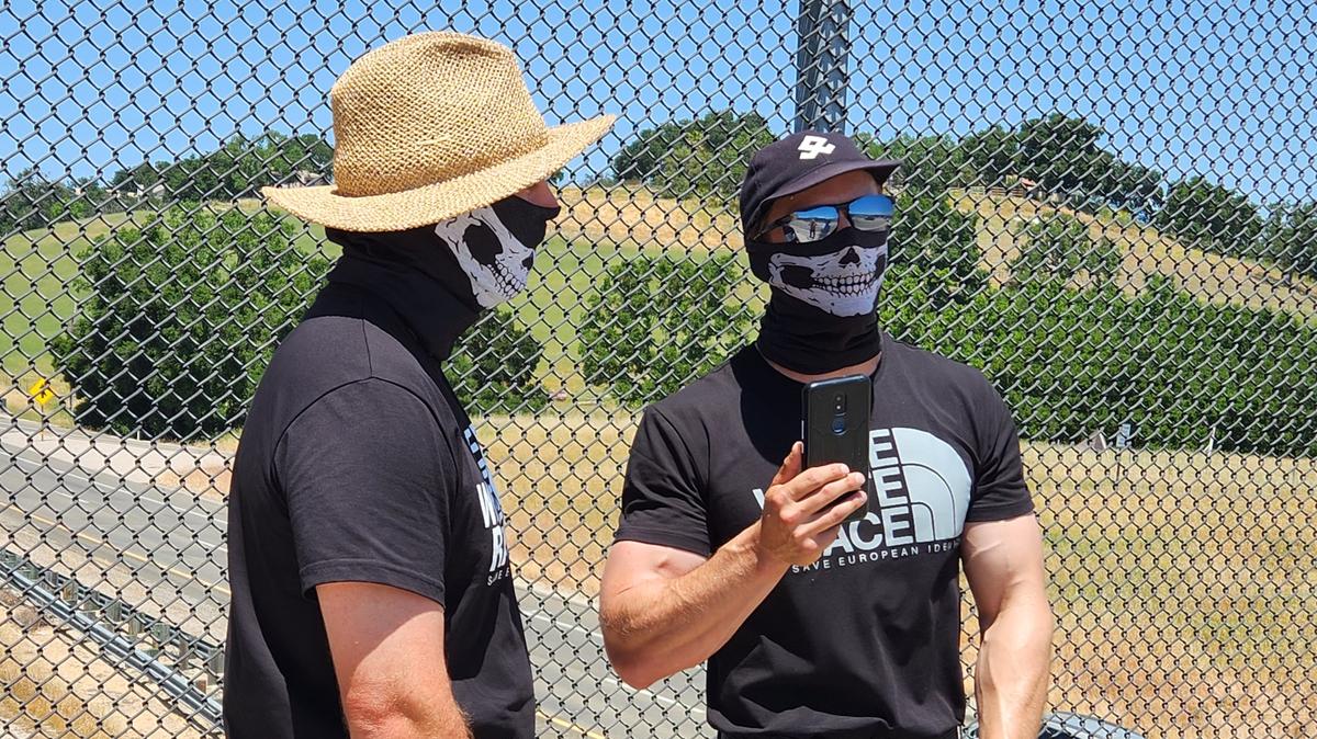 Masked men wearing t-shirts that said “The White Race/Save European Identity” held up a white pride banner on the Vineyard Drive overpass in Templeton in May. Supervisor John Peschong said law enforcement informed him that the men were from Tulare County.