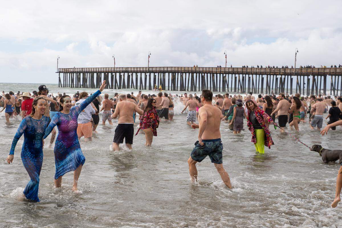 Thousands of divers braved the cold waters of the Pacific Ocean during the annual Carlin Soulé Memorial Polar Bear Dip on Thursday, Jan. 1, 2026. The 46th annual dip drew thousands of divers even amid overcast and rainy weather.
