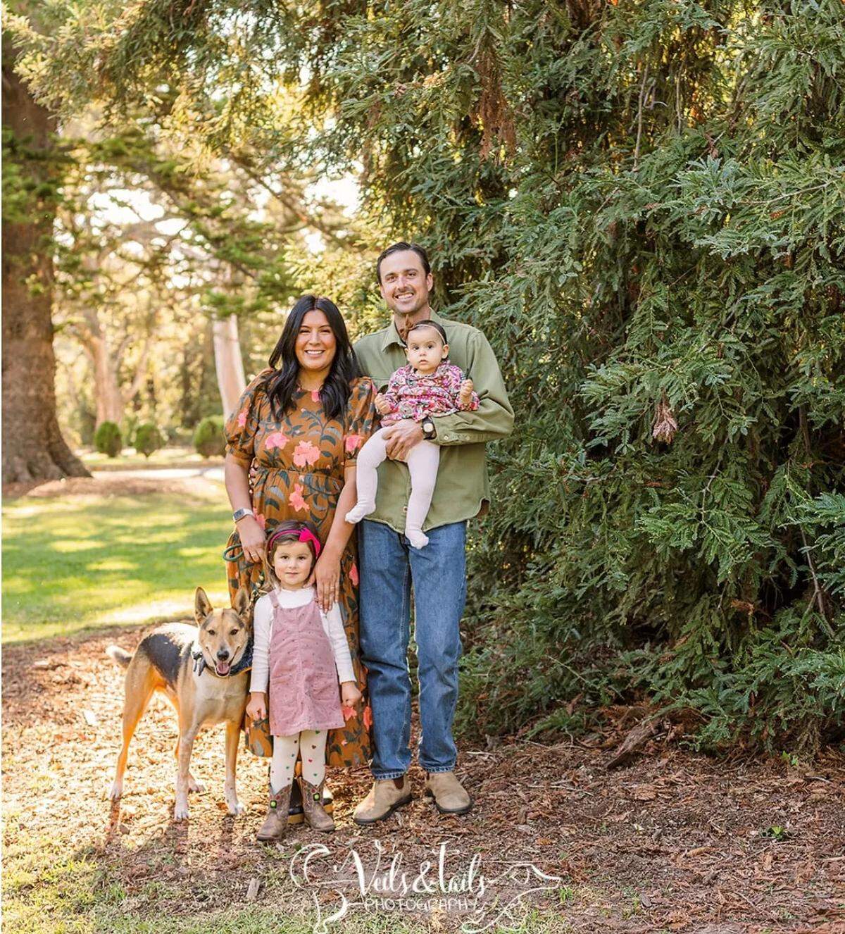 The Alldredge family — parents Jennifer and Ashlan, and daughters June, 3, and Polly, 1 — pose with with Jackson during a portrait session some time before the dog’s ordeal in the Sierra.