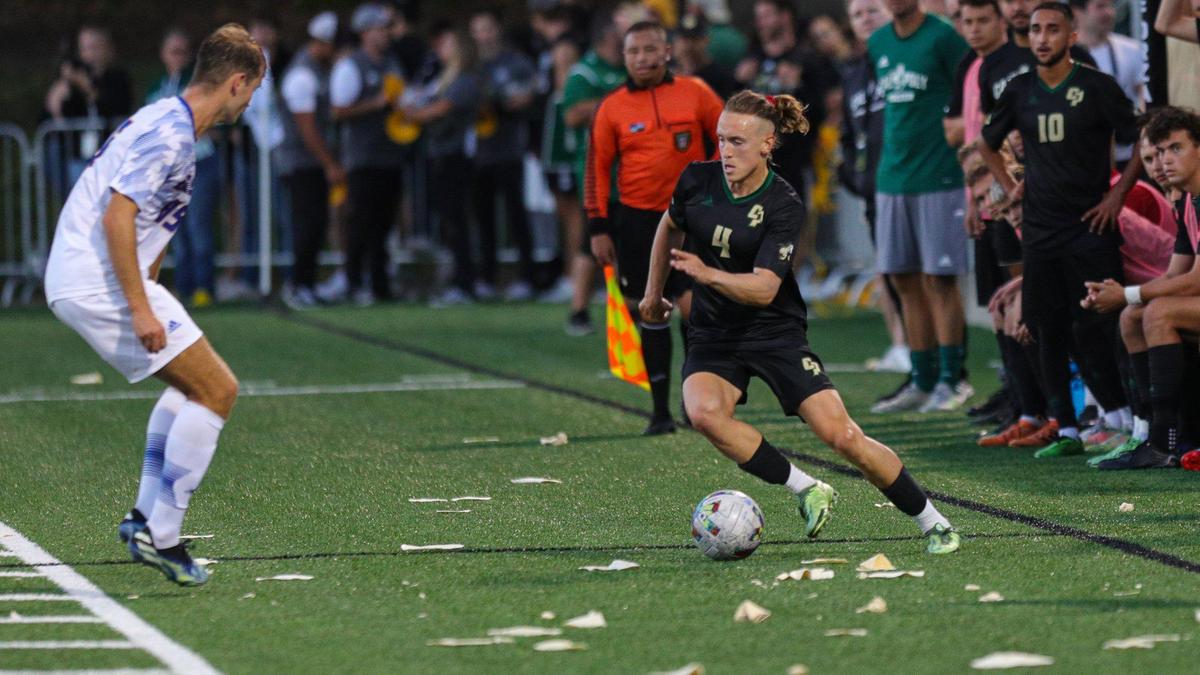Tortillas fell on the field as Logan Thralls looks to pass. Cal Poly fell to UCSB 2-1 in a soccer game tied on a penalty kick and lost in the final minutes. It was the fifth largest crowd at Spanos Stadium and the the biggest crowd for a soccer game this year in the United States.