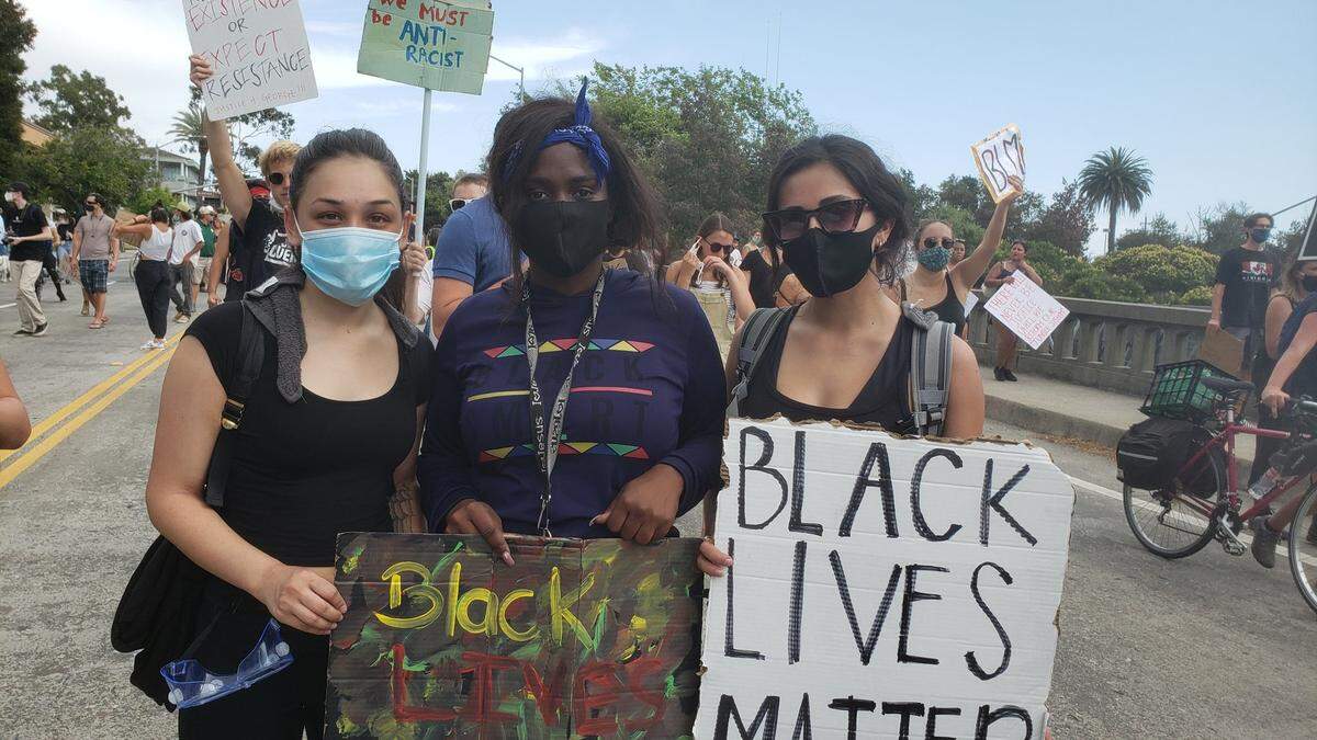 From left, Shanelle McCallie, Jada Ford and Anastasia Gutierrez at a Black Lives Matter protest march in San Luis Obispo on June 3, 2020.