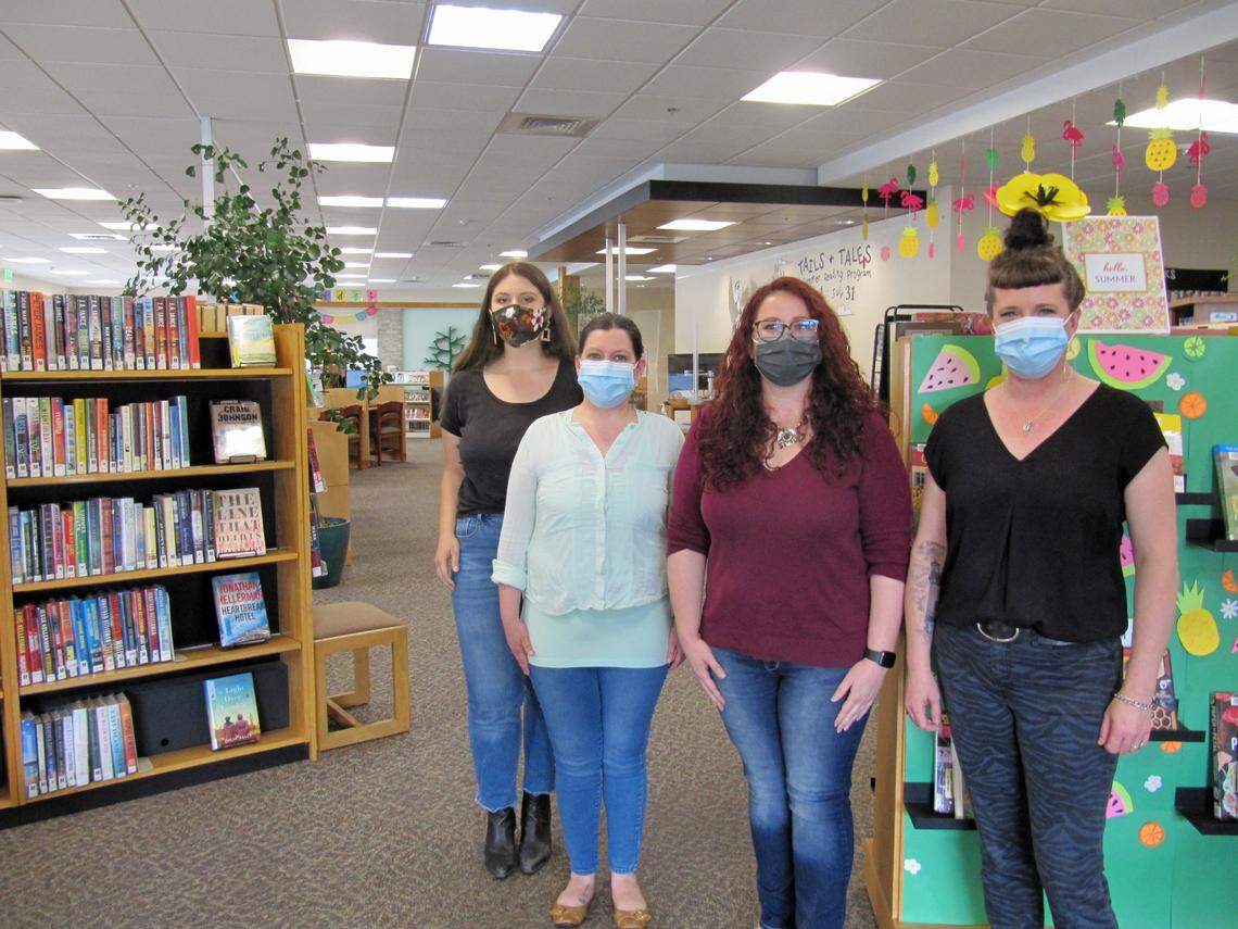 The Cambria Public Library staff includes, from left, Katharine Parra, Ashley Harrington, branch manager Destiny Johnson and Katherine Parra.