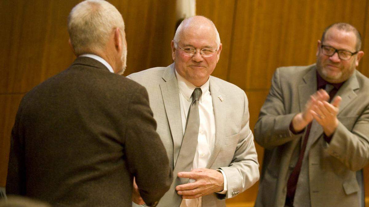 Supervisor Frank Mecham, center, was elected chairman of the Board of Supervisors on Jan. 5. He's congratulated by outgoing chairman Bruce Gibson, left, and newly elected vice chairman Adam Hill.