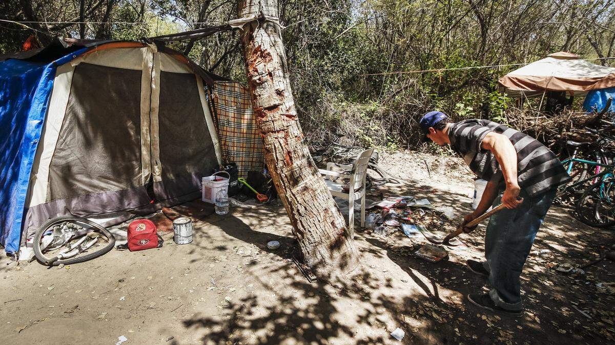 Saying that more than 25 percent of homeless Californians have severe mental illness, Gov. Jerry Brown and state legislators allocated $50 million to local agencies this year to increase services and outreach. Homelessness is increasing statewide and persists in San Luis Obispo County. Here, an unidentified man cleans up around his living area in Grover Beach that was cleared out in 2016.