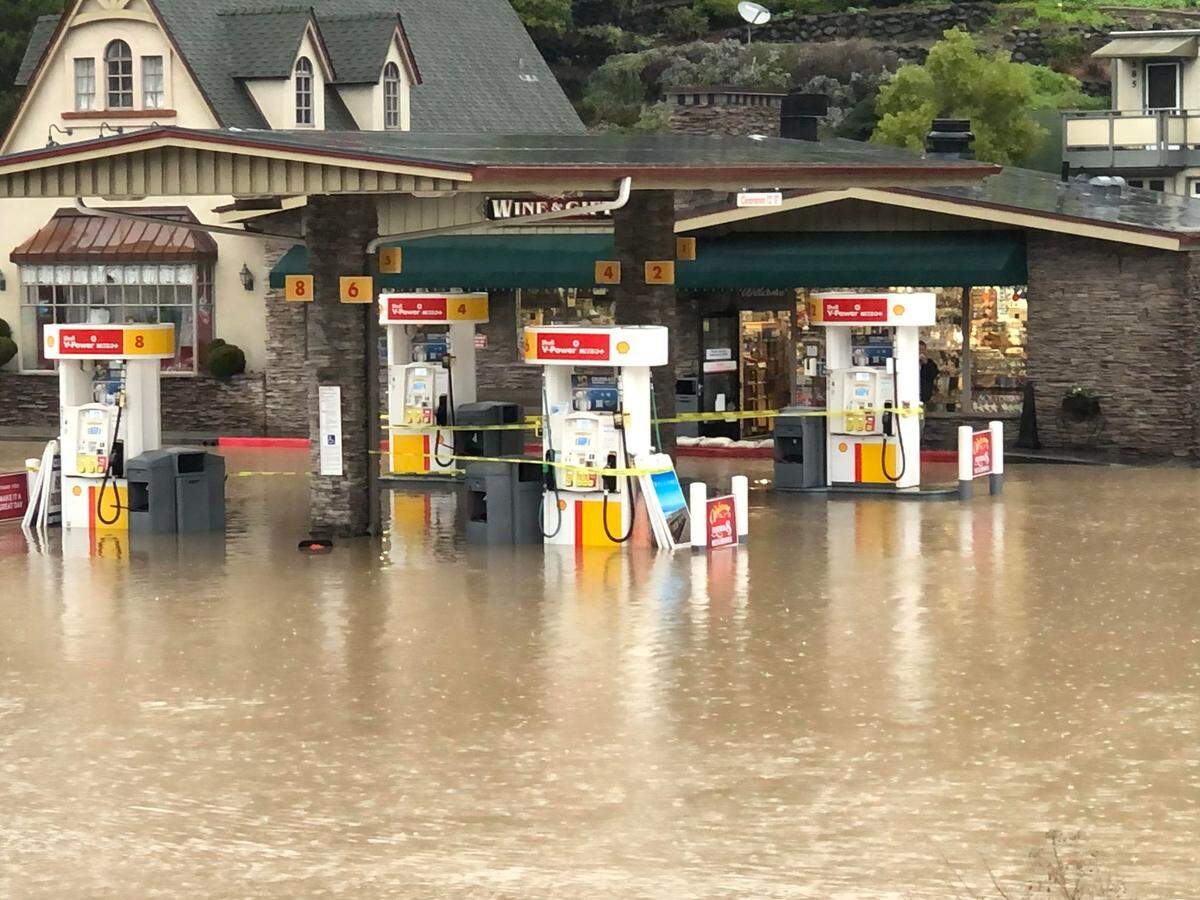 Gas pumps and access to the Old Cambria Marketplace and Shell Station were cut off by floodwaters for a second day on Jan. 9, 2023.