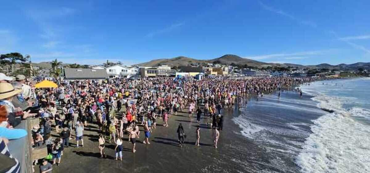 Hundreds of participants turned out for the 2025 Polar Bear Dip near Cayucos Pier, braving water temperatures in the low 50s.