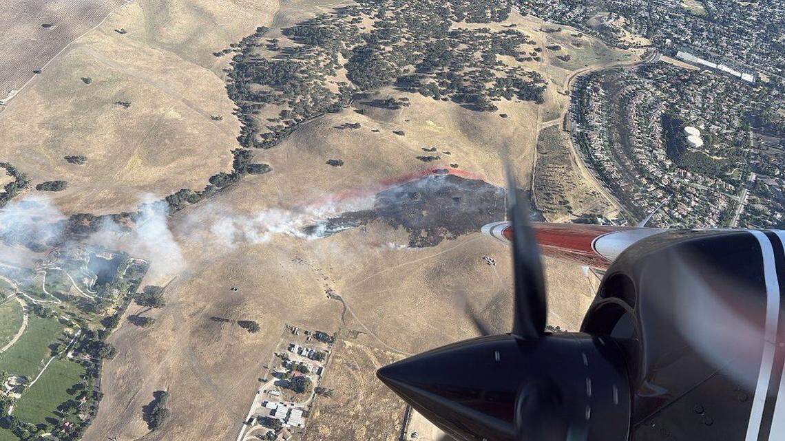 A Paso Robles vegetation fire threatened homes. What caused it?