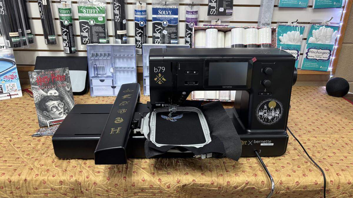 Customers marvel at the Harry Potter-themed sewing machine that is displayed at Atascadero Sewing and Vacuum Center.