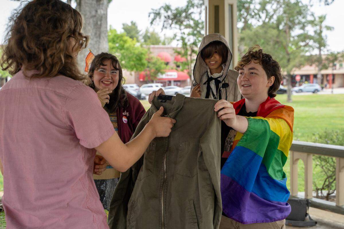 Paso Robles High School Queer Student Union members hold a clothing swap event at Downtown City Park in Paso Robles on Saturday, May 2, 2026. The Queer Student Union offers community to LGBTQ+ students through after-school events such as a clothing swap held in the park.