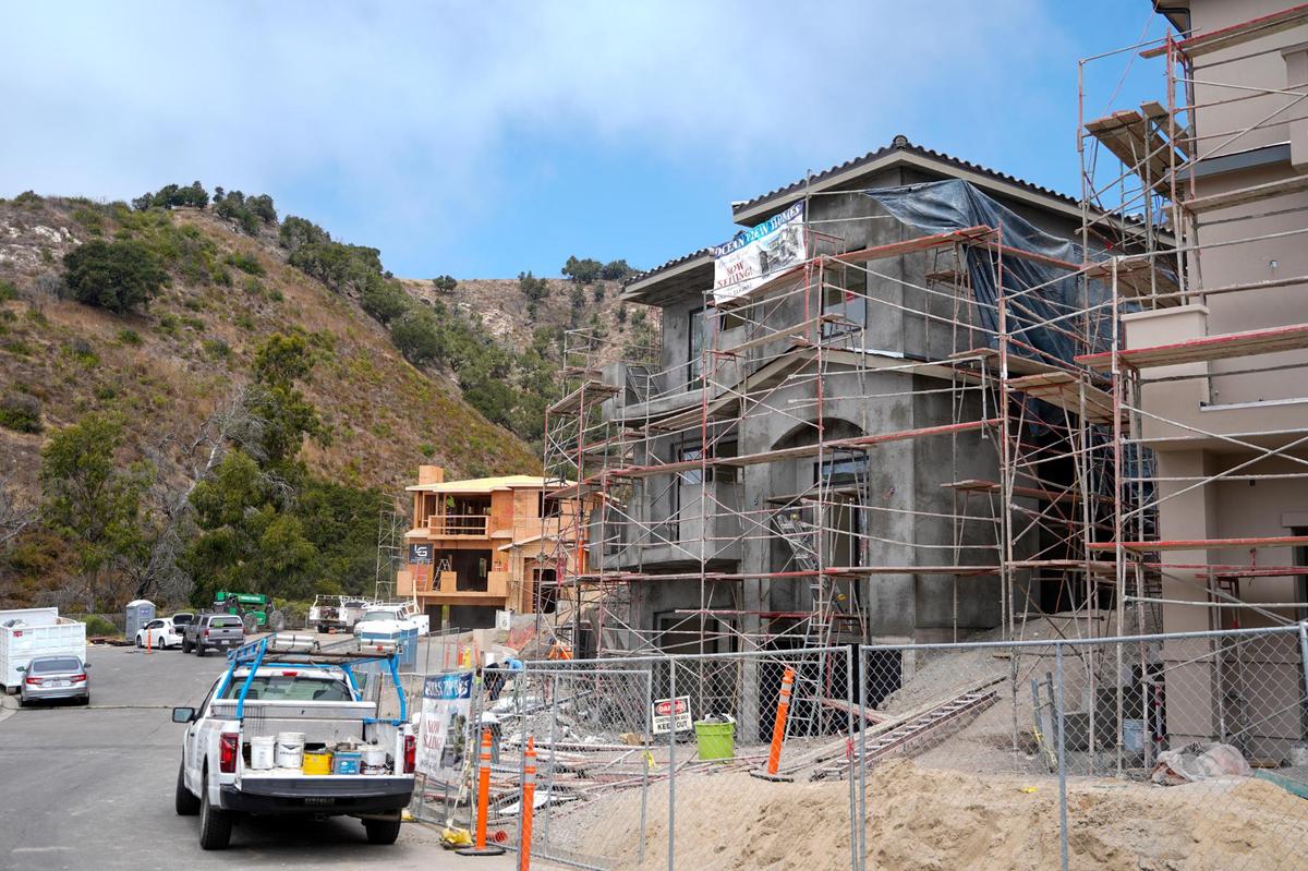 Three-story homes are under construction at Barcelona Point, a new luxury home development in Pismo Beach, borders Highway 101, pictured here Tuesday, July 1, 2025. The homes will range in price between just under $1.87 million for the two-story homes and $2.75 million for larger homes.