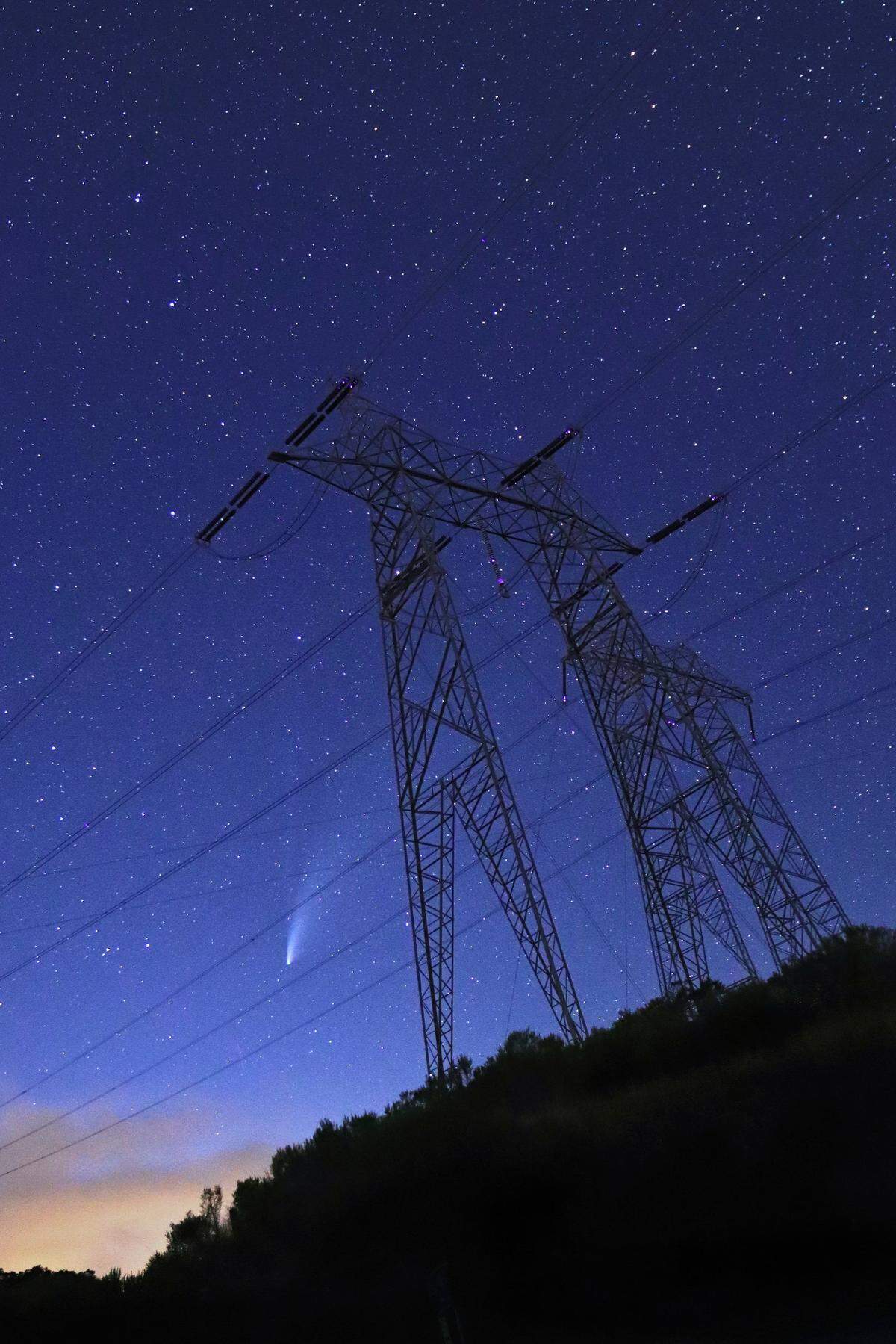 Arroyo Grande photographer Vivian Krug Cotton took this photo of the NEOWISE comet in the sky behind high-voltage towers on July 20, 2020.