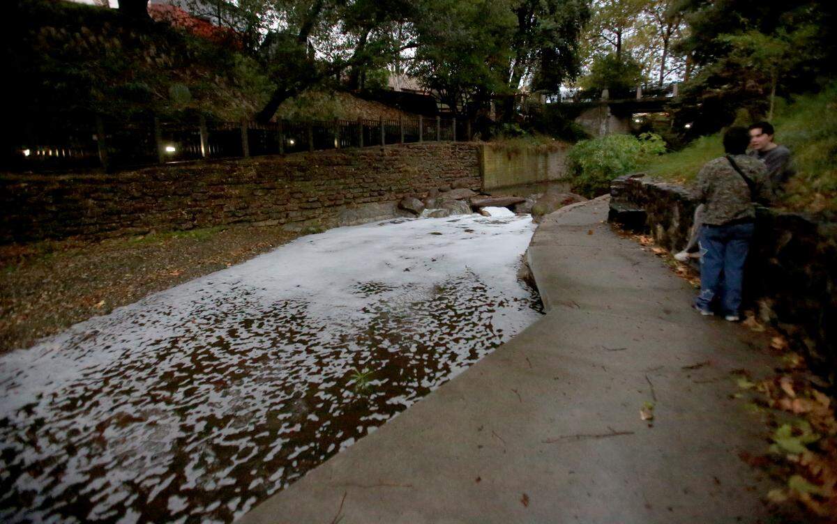 Runoff from the streets filled San Luis Obispo Creek with foam during a storm on Nov. 13, 2025.