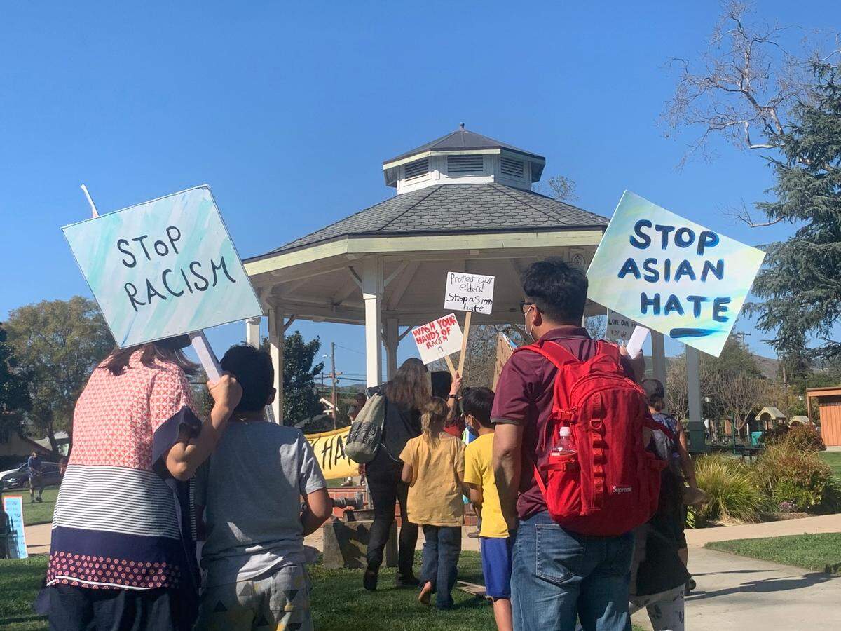 About 100 people gathered at Mitchell Park in San Luis Obispo on Thursday afternoon to rally against anti-Asian American, Pacific Islander hate amid a spate of violent attacks across the United States.
