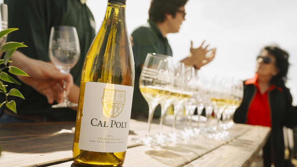 Students serve Cal Poly wine during the groundbreaking ceremony for the college's Center for Wine and Viticulture on Friday, May 4, 2018. The center is anticipated to open by fall 2019.