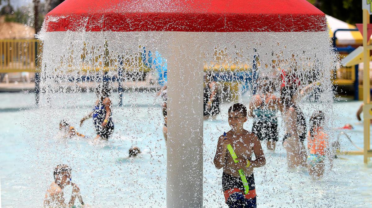 People cool off at The Ravine water park in Paso Robles in 2021. Triple-digit temperatures are on the way next weekend.