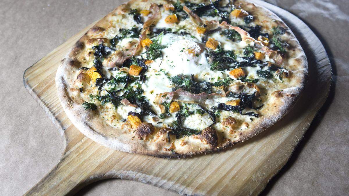 Flatbreads at Ember in Arroyo Grande include this pizza featuring black trumpet mushrooms, nettles, an egg, smokey white sauce, pancetta, butternut squash and thyme.