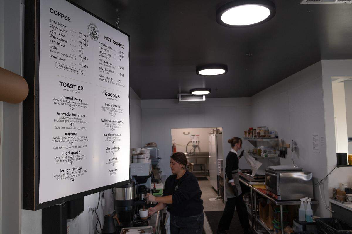 Emily Perry (left) works in the kitchen of Greenhouse Coffee Co. with barista Makenna in Arroyo Grande on Jan. 21, 2023.