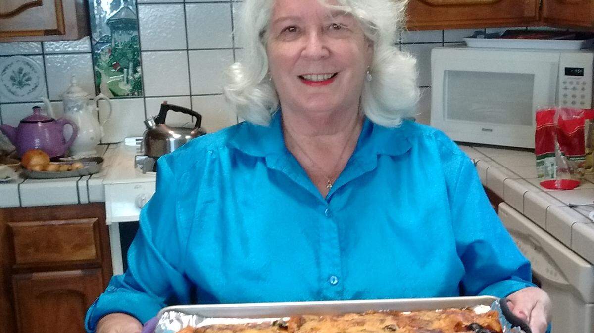 Consuelo Macedo with her signature red enchiladas, made from her own blend of chilies.