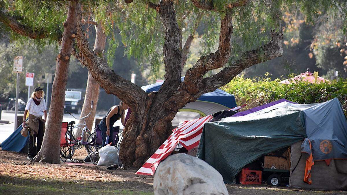 Homeless people set up camp near the parking lot at Santa Barbara’s Pershing Park in January 2021. The city of Santa Barbara is looking to relocate unhoused residents as the fire season approaches.