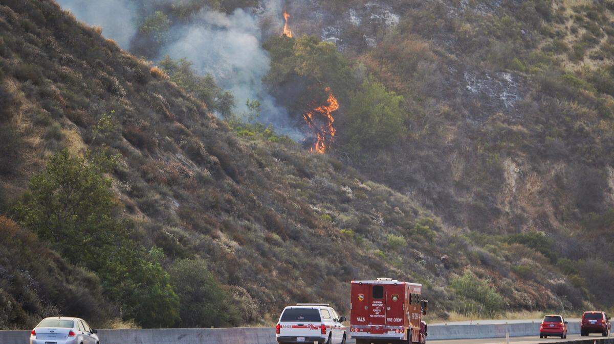 Morning traffic drives over the Cuesta Grade as crews continue to battle the Cuesta Fire on Monday, Aug. 17.