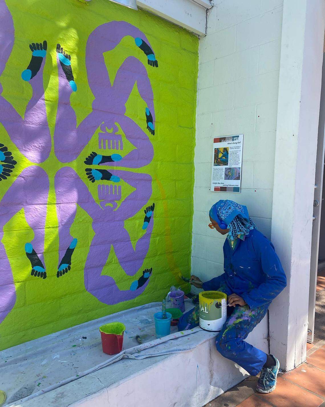 Erin LeAnn Mitchell works on her mural, “Calafia Was Here,” in February at the San Luis Obispo Museum of Art.
