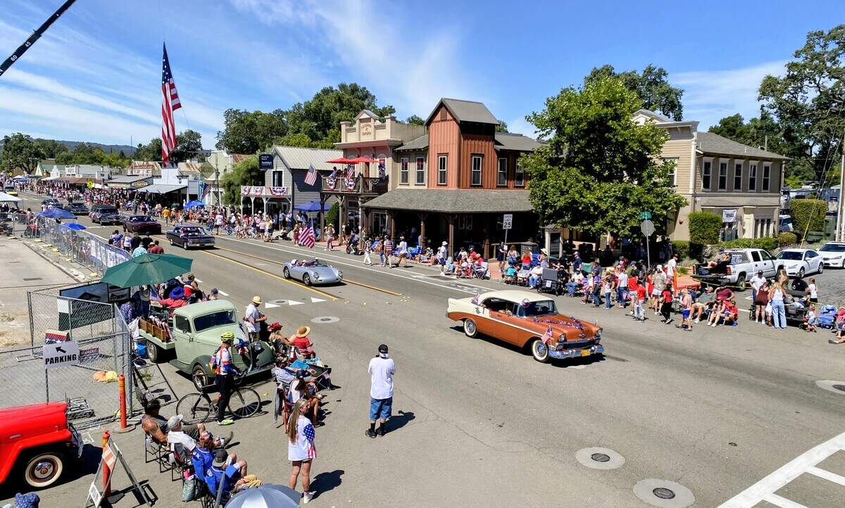 Spectators lined both sides of Main Street as parade entries pass through downtown Templeton on July 4, 2026.