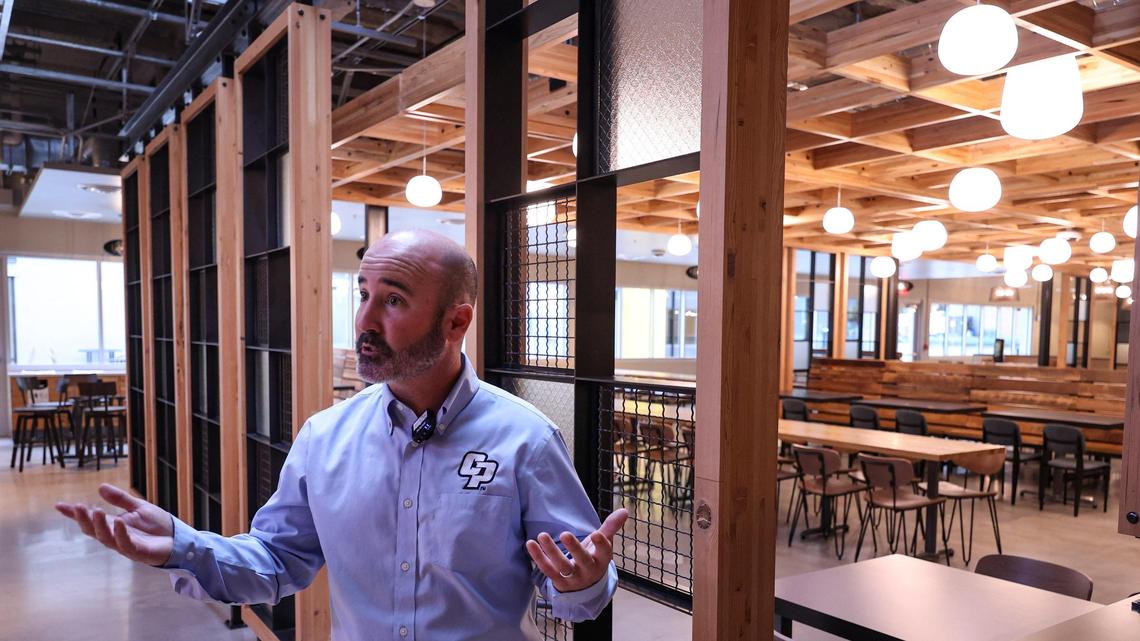 Russell Monteath, director of commercial services with the Cal Poly Corp., leads a tour of the newly renovated 1901 Marketplace dinin complex on Friday, Jan. 19, 2024.