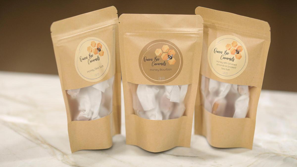 Erin Holden, owner of Queen Bee Caramels in Atascadero, delivered an order worth $18,700 to Laetitia Vineyards and has not been paid by the winery’s previous owner, Vintage Wine Estates. She is seen here on March 5, 2025. Flavors include honey sea salt, honey bourbon and honey with smoked almonds and smoked sea salt, seen here March 5, 2025.