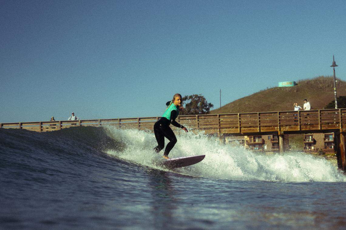 A surfer competes in the third annual Diva Cup Surf Invitational, San Luis Obispo County’s only woman’s surf competition, in Cayucos on Nov. 22, 2025.