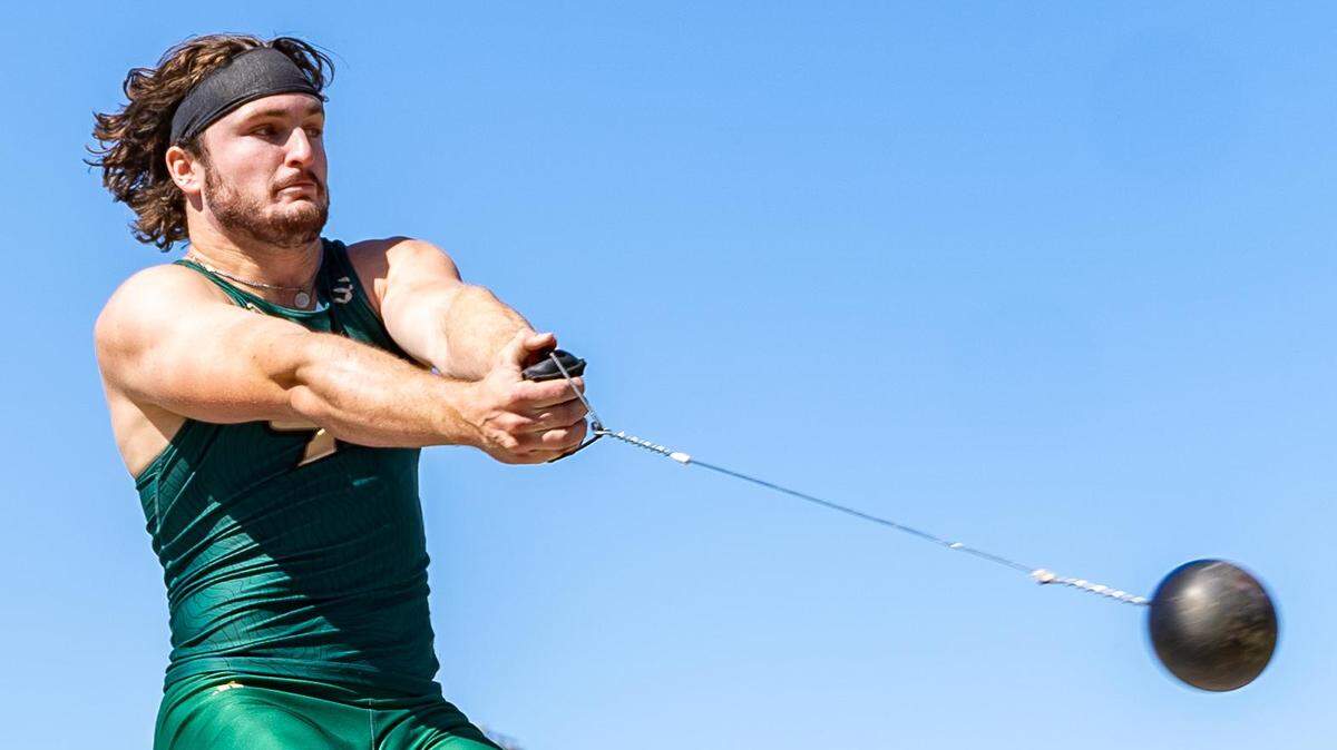 Cal Poly track and field athlete Rory Devaney winds up for a hammer throw.