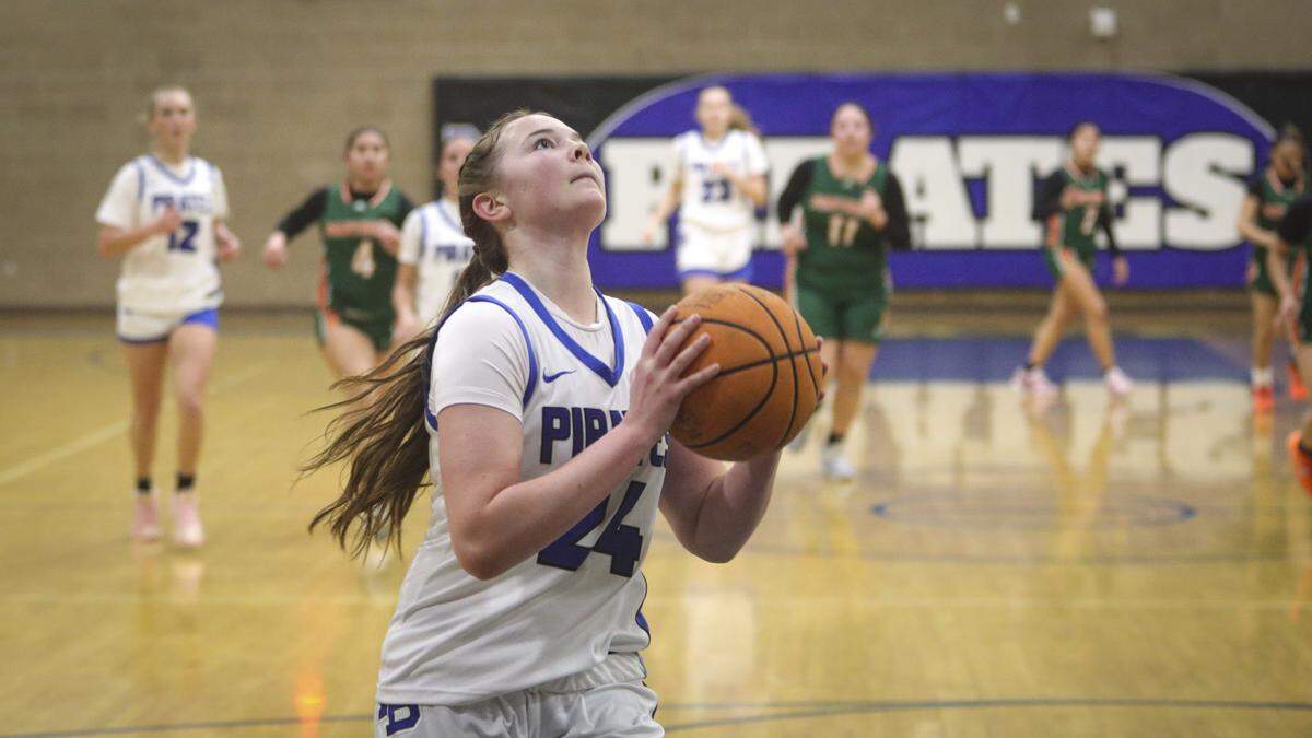 Violet Pace scores on a long outlet pass. Morro Bay beat Porterville 37-25 to advance to the semi-final game in the Division III CIF Central Section Girls Basketball Championships.