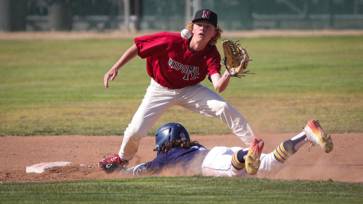 James Bishop slides safely into second as Austin Jones fields the throw. Arroyo Grande won 12-1 over Nipomo May 17, 2022 in a baseball game at Arroyo Grande High School.