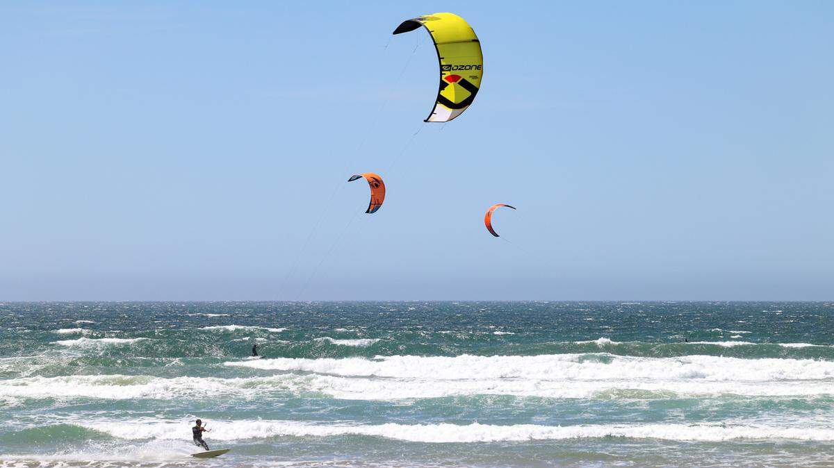 A recent windy day at the Oceano Dunes brought out a trio of kite surfers, who carved the waves parallel to the shore on April 4, 2022.