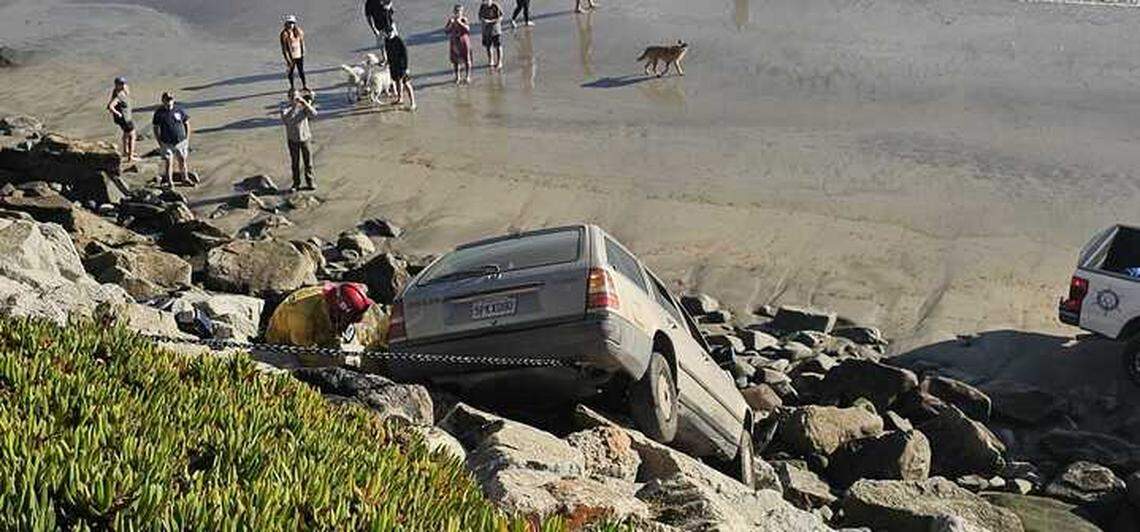 A car collided with another vehicle before crashing off of Avila Beach Drive onto Olde Port Beach below Wednesday, Jan. 1, 2025.