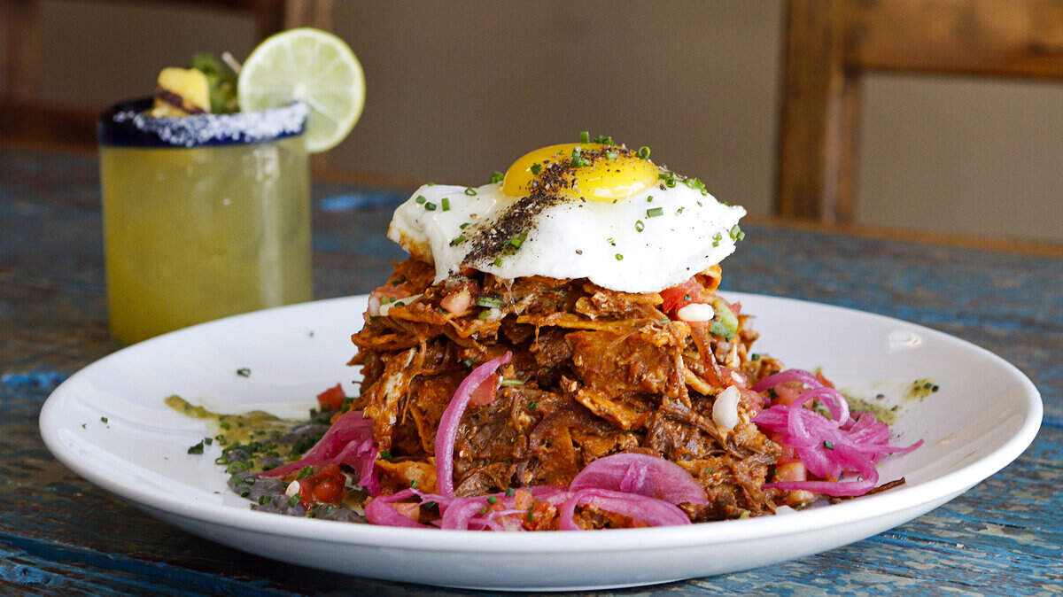 Short rib chilaquiles are paired with a pineapple jalapeño margarita at Fish Gaucho in Paso Robles.
