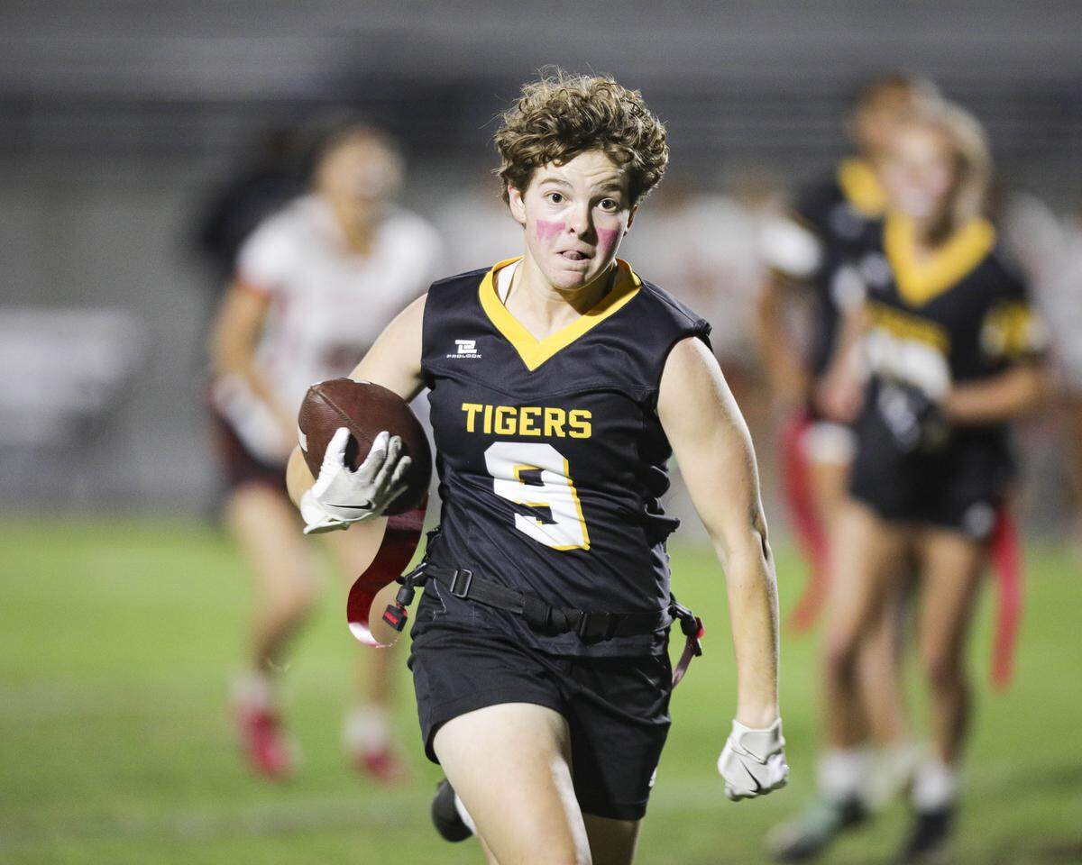 Giana Boscaro runs with the ball. San Luis Obispo beat Santa Maria 51-6 in a girl's flag football game seen here on Oct. 16, 2025.