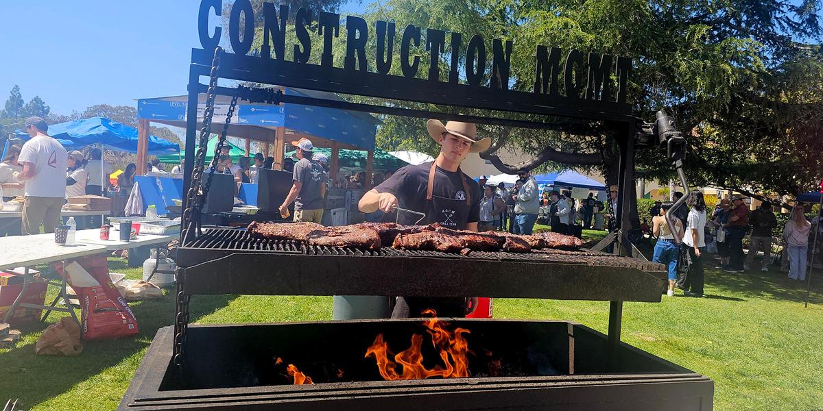 Cnstruction managment major Nick Milligan tended a hot barbecue of tri-tip steaks.
