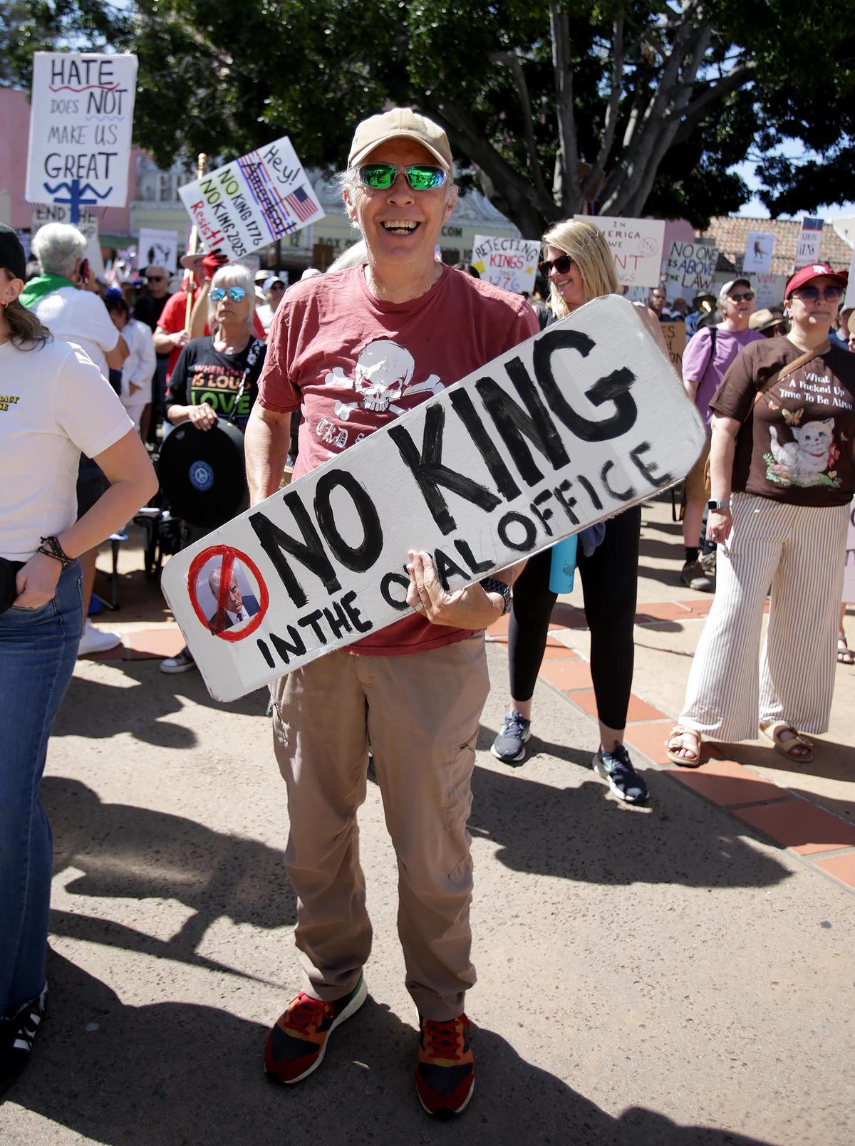 Atascadero resident Robert Dyer hold a sign in front of the SLO County Superior courthouse. Rallies were scheduled in three SLO County cities, joining 1,800 total nationwide to take a stand against what organizers and rally-goers see as the Trump administration’s overreach of executive power.