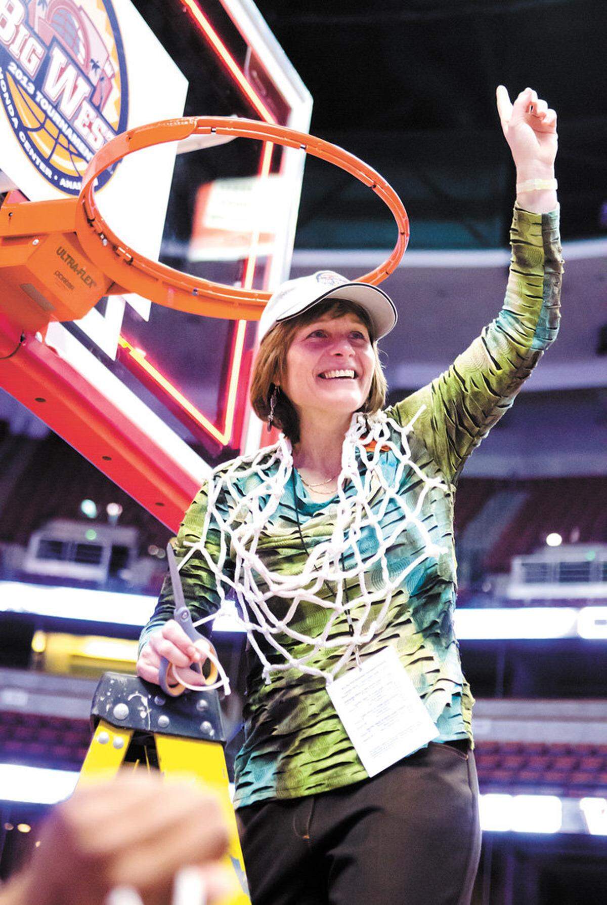 Cal Poly women’s basketball head coach Faith Mimnaugh wears the net around her neck following a 63-49 victory over Pacific in the 2013 Big West Conference Tournament title game.