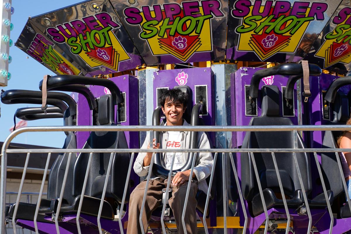 Tribune news reporter Angel Corzo rides the Super Shot at the California Mid-State Fair on Wednesday, July 16, 2025. The Mid-State Fair will run from July 16-27.