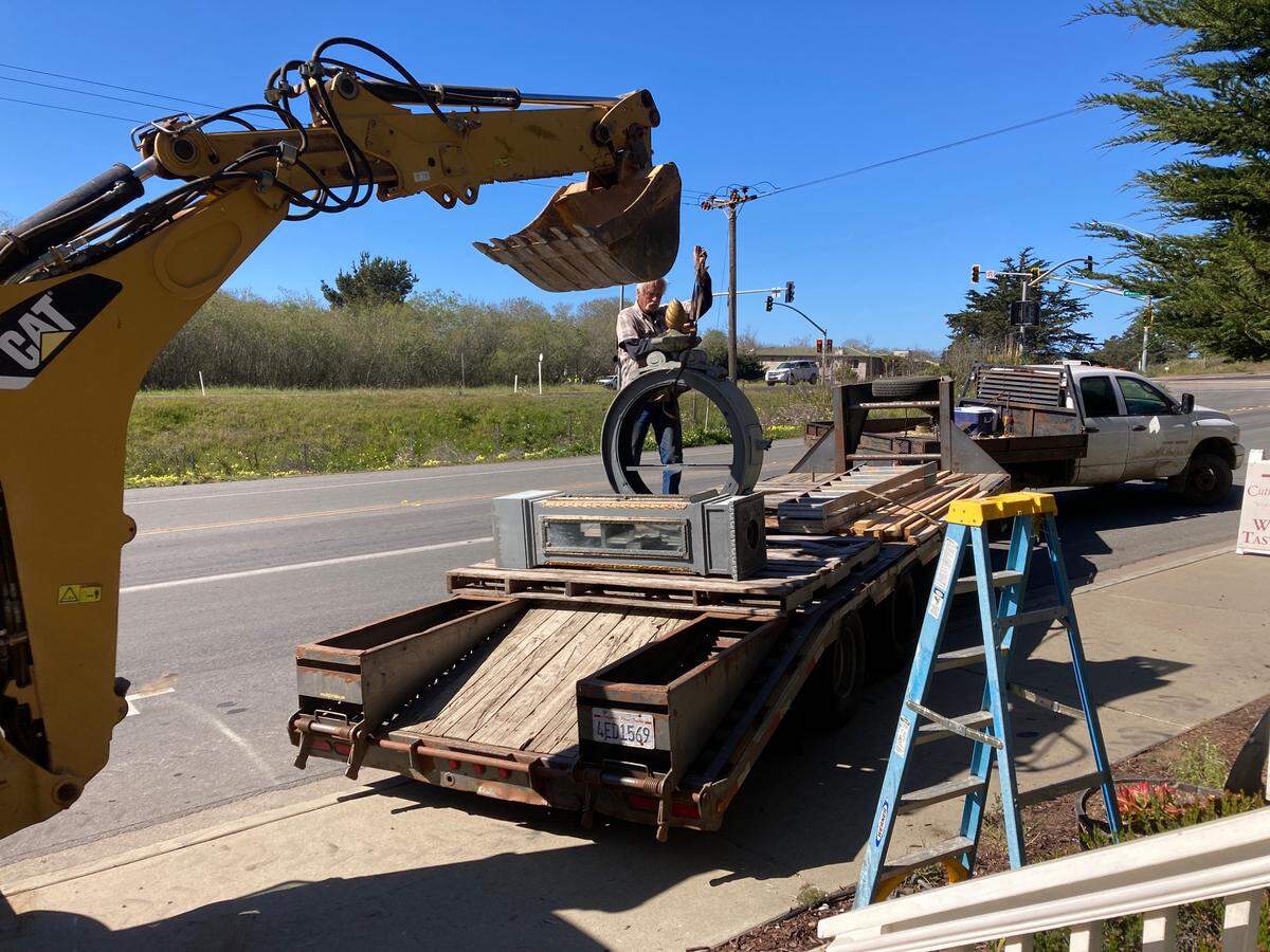 Billy Thomas of Morro Bay secures the disassembled town clock for shipping to a Wisconsin collector. The clock has stood in Cambria’s West Village since 1991.