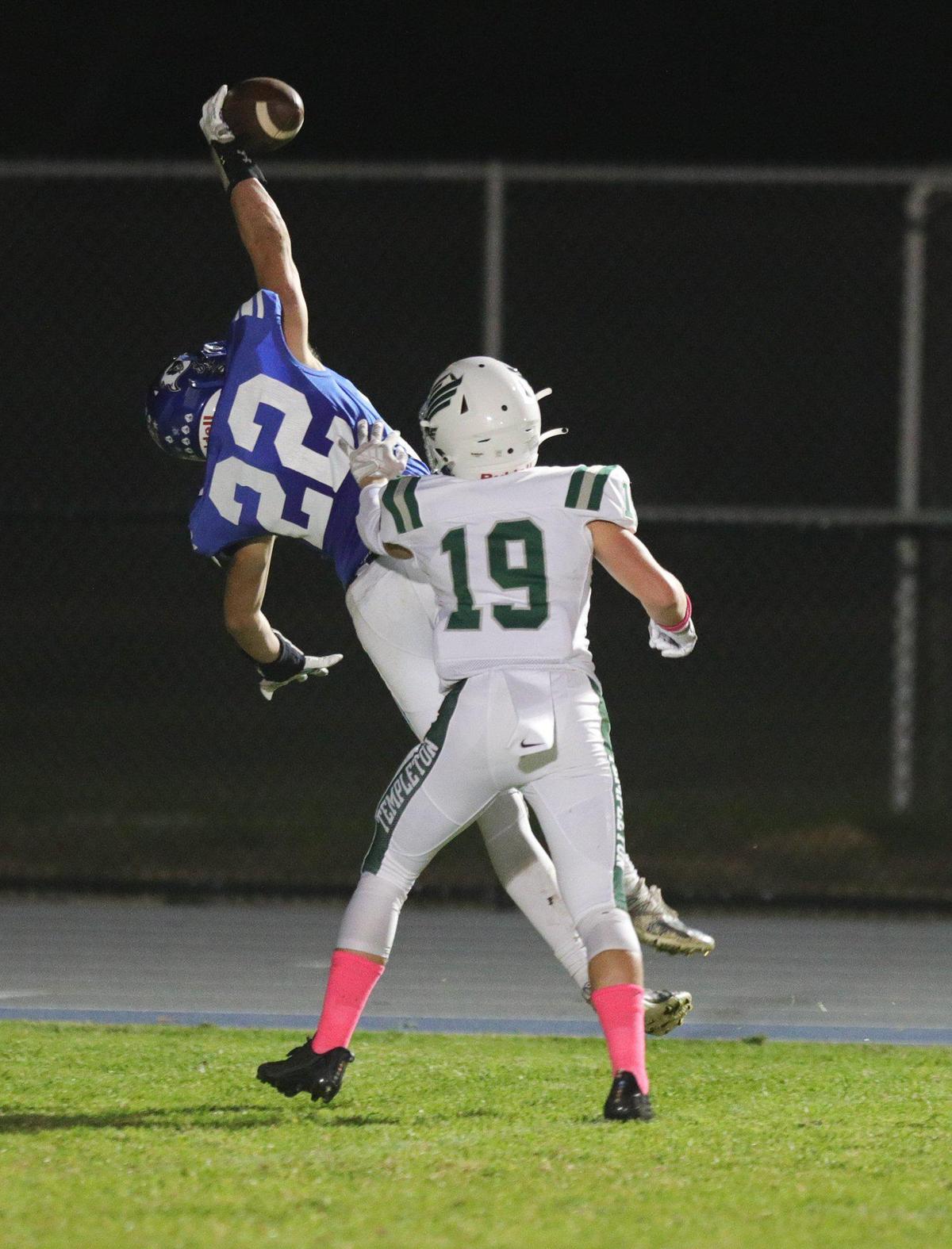 Aiden Blackwood makes an attempt at a one-handed catch, but the pass fell incomplete while Daxton Calagna defends. Templeton beat Morro Bay 27-9 in an Ocean League football game on Oct. 21, 2022.