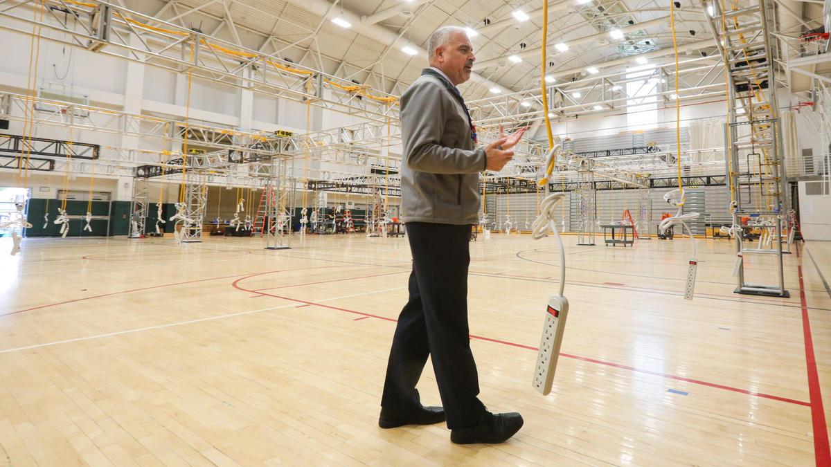 Mark Lisa, CEO of Tenet Central Coast, discusses progress in the Phase II medical area at the Cal Poly Rec Center iin April 2020 as workers prep the facility as an alternate care site for COVID-19 patients.