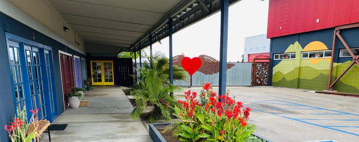 The Los Osos home of Barb and Jeri Saia matches the industrial aesthetic of surrounding buildings with metal siding and decorative metal gates created by Formula Factory Fabrication in Los Osos.