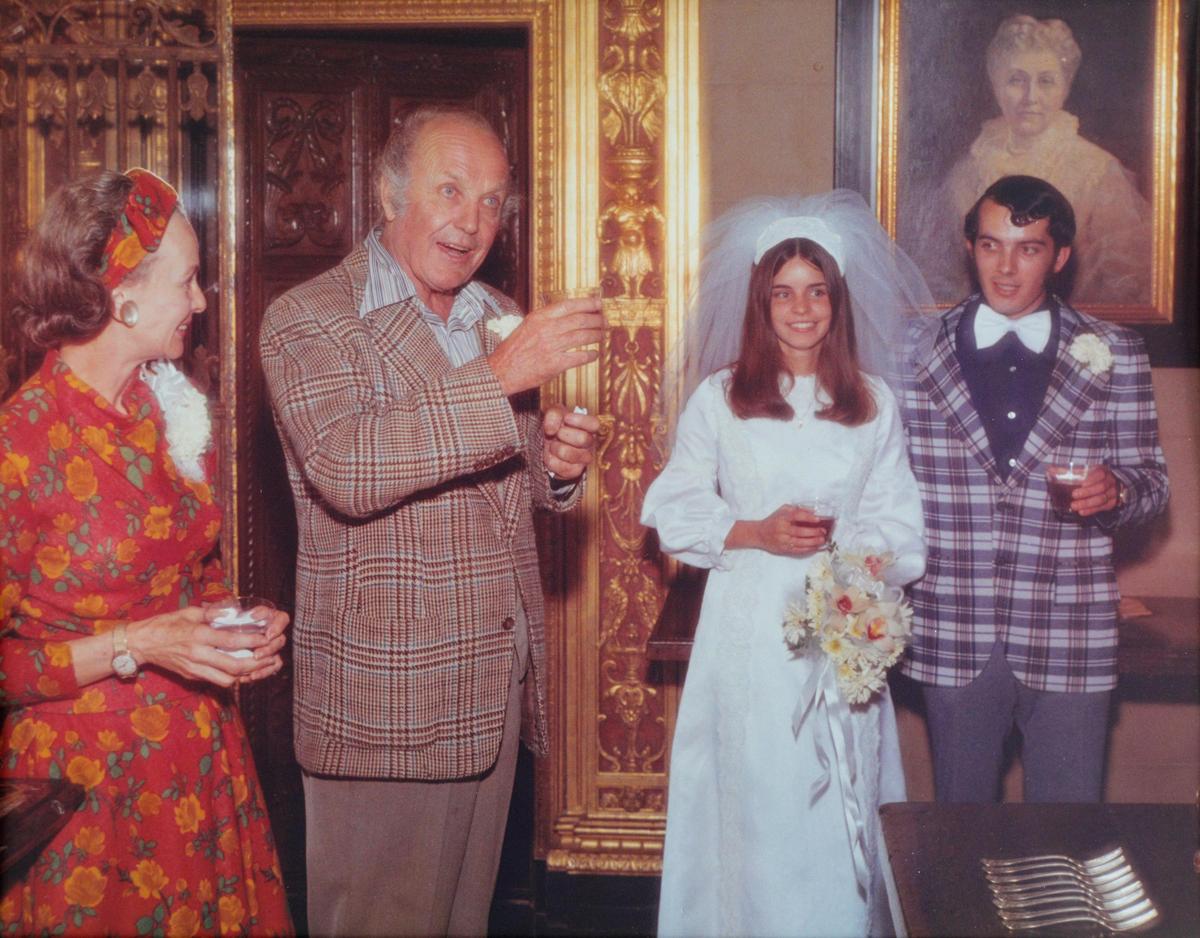 Austine and Bill Hearst Jr., far left and left center, toast Betsy and Hoyt Fields as they are married at the Casa Del Mar guest house at Hearst Castle in San Simeon. Hoyt Fields is in his 51st year of working at Hearst Castle, now as a retired annuitant and former museum director.