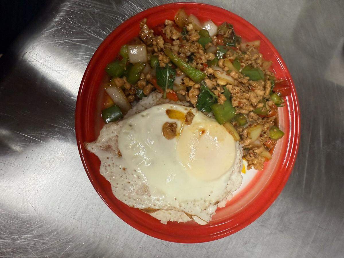 Pad Krapow Moo at Thai Easy Bowl in San Luis Obispo is served with ground pork in a chili garlic sauce over steamed rice and a fried egg.